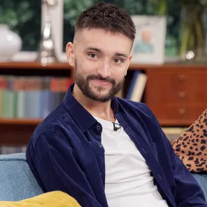 Singer Tom Parker Smiling During A Photoshoot Wallpaper