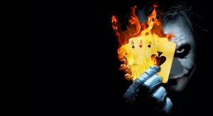 Sinister Joker Card On Abstract Background Wallpaper