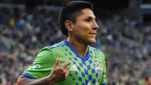 Skilled Striker, Raul Ruidiaz, In Action On Soccer Field Wallpaper