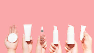 Skincare_ Products_ Showcase_ Pink_ Background Wallpaper