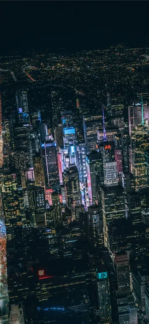 Skyscrapers Light Up The Night Sky In Night City. Wallpaper