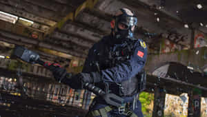 Sledge, The Elite Attacker In Rainbow Six Siege, Equipped With His Tactical Hammer And Ready For Action. Wallpaper