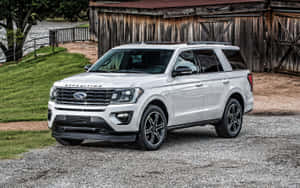 Sleek 2021 Ford Expedition Cruising On A Scenic Road Wallpaper