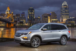 Sleek 2021 Honda Pilot On Scenic Road Wallpaper