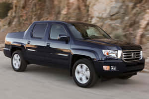 Sleek 2023 Honda Ridgeline Pickup Truck On The Road Wallpaper