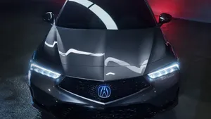 Sleek Acura Integra In A Cityscape Background Wallpaper