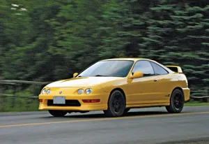 Sleek Acura Integra On The Road Wallpaper