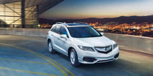 Sleek Acura Mdx Suv On The Open Road Wallpaper