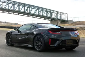Sleek Acura Nsx Sports Car On The Open Road Wallpaper