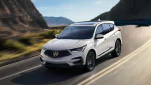 Sleek Acura Rdx On Scenic Road Wallpaper