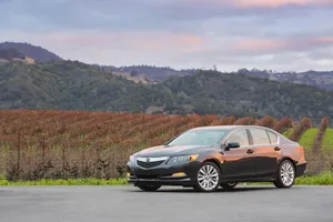 Sleek Acura Rlx Cruising The Streets Wallpaper