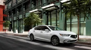Sleek Acura Rlx Cruising Through A Scenic Route Wallpaper