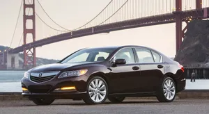 Sleek Acura Rlx In A Modern Cityscape Wallpaper