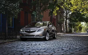 Sleek Acura Rlx In A Stunning Urban Setting Wallpaper