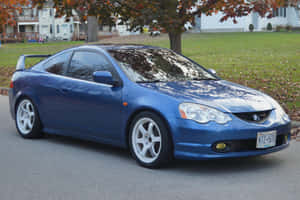 Sleek Acura Rsx Sports Coupe On The Open Road Wallpaper