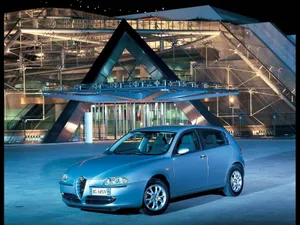 Sleek Alfa Romeo 147 On An Open Road Wallpaper