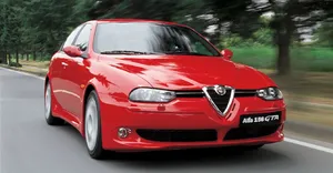 Sleek Alfa Romeo 156 Cruising On An Open Road Wallpaper