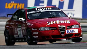 Sleek Alfa Romeo 156 In Action Wallpaper