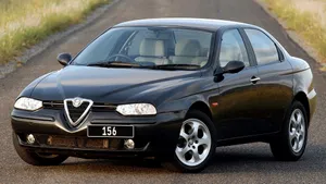 Sleek Alfa Romeo 156 On The Road Wallpaper