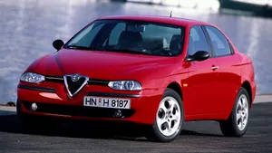 Sleek Alfa Romeo 156 Parked Outdoors ( Wallpaper