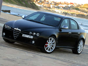 Sleek Alfa Romeo 159 On A Scenic Drive Wallpaper