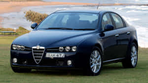 Sleek Alfa Romeo 159 On Scenic Road Wallpaper