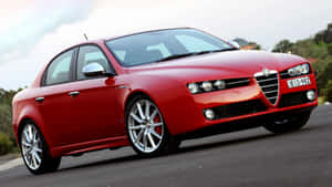 Sleek Alfa Romeo 159 On The Road Wallpaper