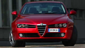 Sleek Alfa Romeo 159 On The Road Wallpaper