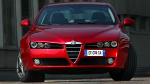 Sleek Alfa Romeo 159 On The Road Wallpaper