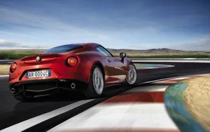 Sleek Alfa Romeo 4c Sports Car In Action Wallpaper