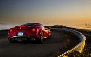 Sleek Alfa Romeo 4c Sports Car On Scenic Road Wallpaper