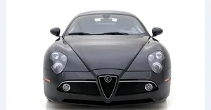 Sleek Alfa Romeo 8c Competizione Cruising The Streets Wallpaper