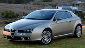 Sleek Alfa Romeo Brera In A Majestic Landscape Wallpaper