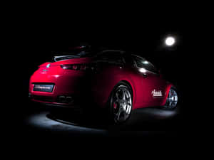 Sleek Alfa Romeo Brera In A Scenic Road Setting Wallpaper