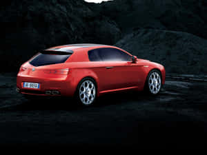 Sleek Alfa Romeo Brera In Motion Wallpaper