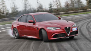 Sleek Alfa Romeo Giulia In Motion Wallpaper