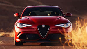 Sleek Alfa Romeo Giulia In Vibrant City Background Wallpaper