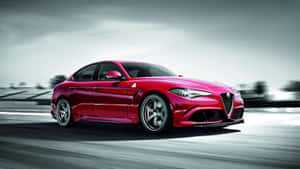 Sleek Alfa Romeo Giulia In Vibrant City Setting Wallpaper