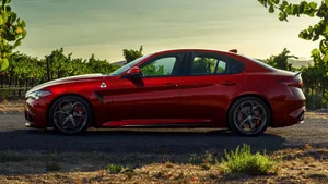 Sleek Alfa Romeo Giulia Showcasing Its Elegant Design And Dynamic Curves Wallpaper