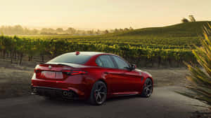 Sleek Alfa Romeo Giulia Showcasing Its Luxurious Design And Performance Wallpaper