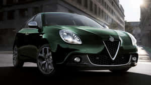 Sleek Alfa Romeo Giulietta Cruising On The Open Road Wallpaper