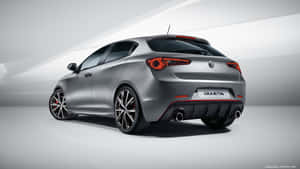 Sleek Alfa Romeo Giulietta In Action Wallpaper