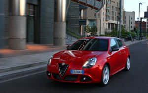 Sleek Alfa Romeo Giulietta In Motion Wallpaper