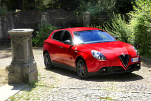 Sleek Alfa Romeo Giulietta In Motion Wallpaper