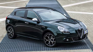 Sleek Alfa Romeo Giulietta On Display At An Outdoor Location Wallpaper