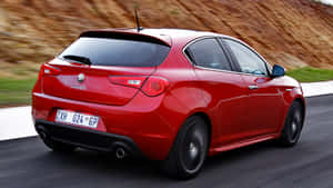 Sleek Alfa Romeo Giulietta On Display Wallpaper