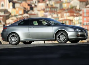 Sleek Alfa Romeo Gt On The Open Road Wallpaper