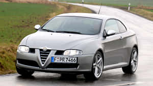 Sleek Alfa Romeo Gt On Urban Streets Wallpaper