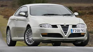 Sleek Alfa Romeo Gt Sports Car On Open Road Wallpaper