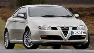 Sleek Alfa Romeo Gt Sports Coupe On City Streets Wallpaper